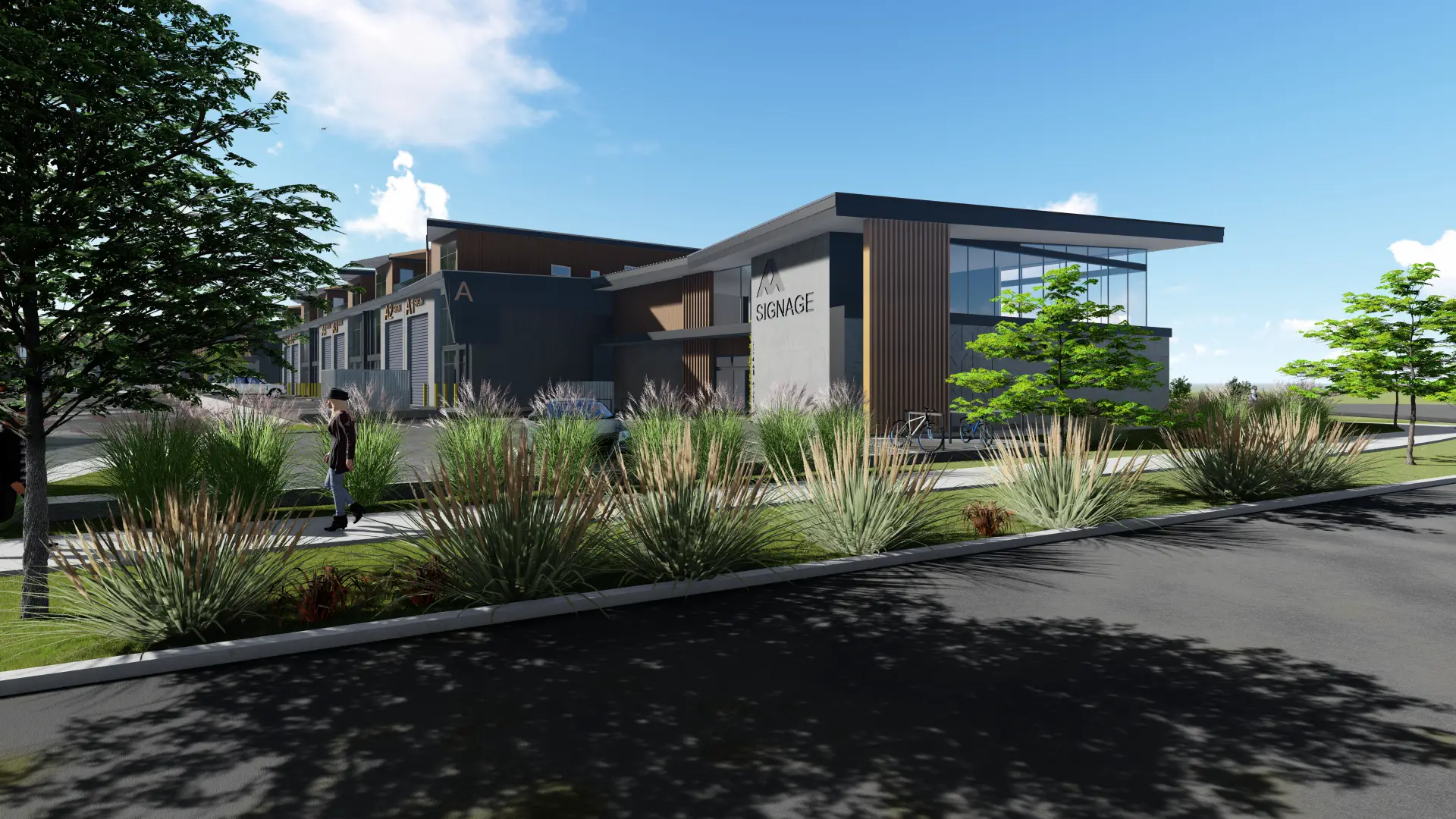 A ground-floor amenity building in the precinct with a glazed corner, vertical timber fins and landscaped planting along the footpath